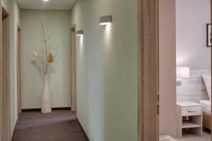a hallway with a vase of flowers in a room at Hotel Florenc in Prague