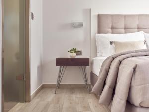 A bed or beds in a room at Bright Coast Superior