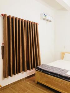 Postel nebo postele na pokoji v ubytování An Ngọc Linh Hotel