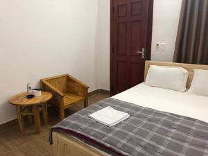 Postel nebo postele na pokoji v ubytování An Ngọc Linh Hotel