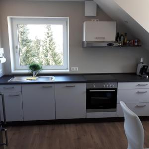 Kuchyň nebo kuchyňský kout v ubytování Ferienwohnung Weigert