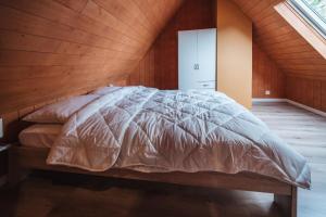 Säng eller sängar i ett rum på Terrasses de Malmedy Chalet 113