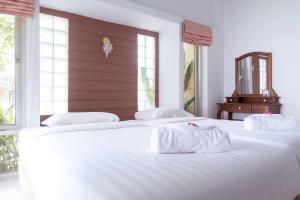 Postel nebo postele na pokoji v ubytování Wang Yao Riverside Resort