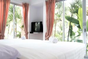 Postel nebo postele na pokoji v ubytování Wang Yao Riverside Resort