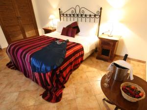 Posteľ alebo postele v izbe v ubytovaní Hotel Rural Molino del Puente Ronda