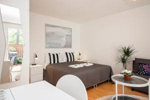 Ένα ή περισσότερα κρεβάτια σε δωμάτιο στο Guest Apartment Tuuttikuja