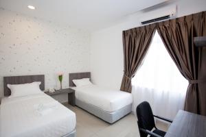 Postel nebo postele na pokoji v ubytování Twenty Nine Hotel