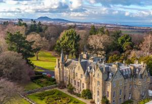 an aerial view of a castle at Carberry Tower Mansion House and Estate in Musselburgh