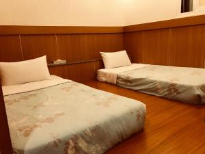 Ein Bett oder Betten in einem Zimmer der Unterkunft 真正好旅店 Good Hotel