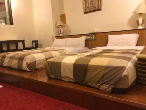 Ein Bett oder Betten in einem Zimmer der Unterkunft 真正好旅店 Good Hotel