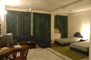 Ένα ή περισσότερα κρεβάτια σε δωμάτιο στο Jaisamand Island Resort