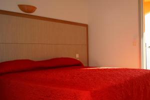 Кровать или кровати в номере L'Allegria