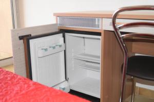 a toy kitchen with a refrigerator in a desk at Hotel L'Allegria in Casaglione