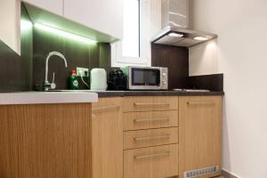 A kitchen or kitchenette at TONI'S Classy Home in Kolonaki, local's Gem