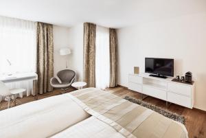 Postel nebo postele na pokoji v ubytování Hotel Uzwil