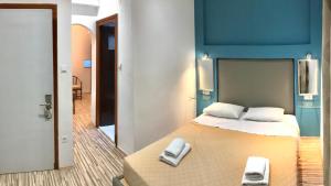 Postel nebo postele na pokoji v ubytování Atlantis Hotel