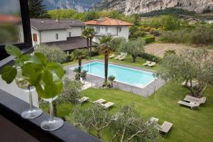 a view of a swimming pool from a house at Park Hotel Eden in Nago-Torbole