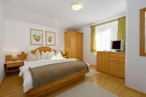 Ένα ή περισσότερα κρεβάτια σε δωμάτιο στο Appartements Reiter