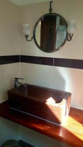 a sink on a counter in a bathroom with a mirror at Chambres d'Hôtes La Stoob Strasbourg Sud in Illkirch-Graffenstaden