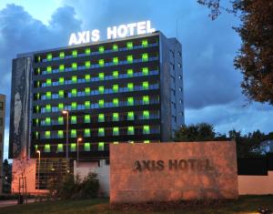 a building with a ans hotel sign on top of it at Axis Porto Business & Spa Hotel in Porto