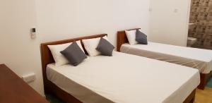 Postel nebo postele na pokoji v ubytování Fairview Residence
