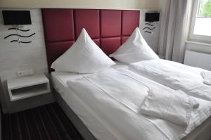 Krevet ili kreveti u jedinici u okviru objekta Avalon Hotel Bellevue