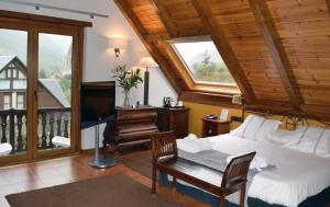TV a/nebo společenská místnost v ubytování Mauberme Mountain Boutique Hotel
