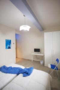 En eller flere senge i et værelse på La Diletta - Camere di Charme