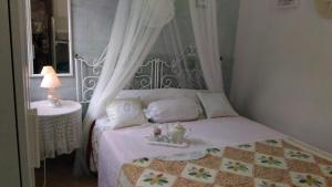 Posteľ alebo postele v izbe v ubytovaní Casa sul Mare vicino Marzamemi