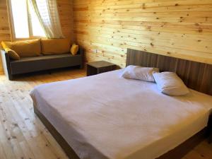 Кровать или кровати в номере ZAMBAK Holiday Village