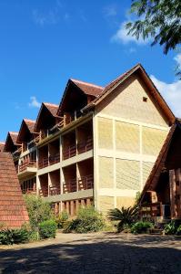 a large apartment building with a large garage at Pousada na Montanha in Domingos Martins