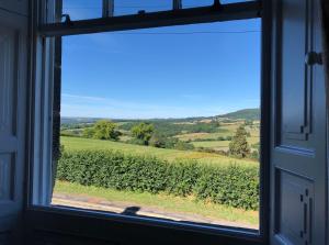 a window with a view of a vineyard at Carr View Hall Apt3 Grade II Listed in Sleights