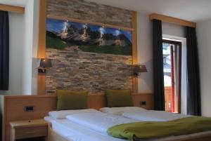 Postel nebo postele na pokoji v ubytování Hotel Garni Walter