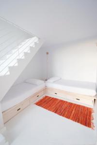 A bed or beds in a room at Akassa Alojamientos Bioclimaticos en las Hurdes
