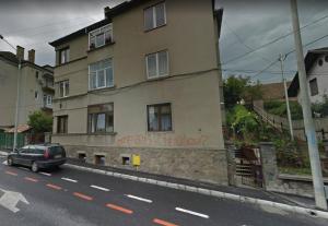 a car parked in front of a building with graffiti on it at Transilvania Studio in Sibiu