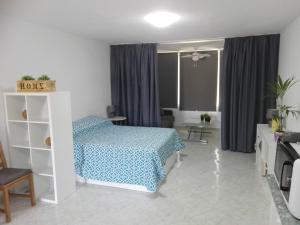 Łóżko lub łóżka w pokoju w obiekcie Large Loft Sueño Azul ocean view
