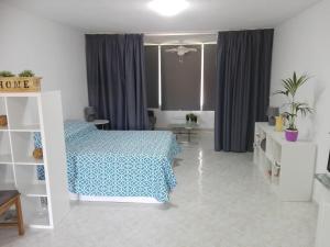 Łóżko lub łóżka w pokoju w obiekcie Large Loft Sueño Azul ocean view