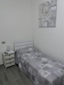 Postel nebo postele na pokoji v ubytování Affittacamere Il Borgo