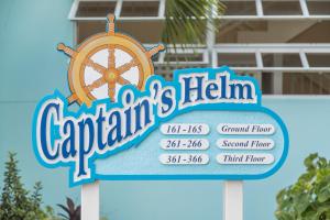 a sign for captainichrift island with a wheel on it at Bay Gardens Marina Haven in Gros Islet