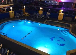 a large swimming pool with a shark painted on it at North Wind Motel in North Wildwood +9 photos