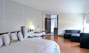Voodi või voodid majutusasutuse Hotel LP Columbus toas