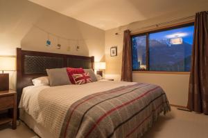 Säng eller sängar i ett rum på Home Lodge