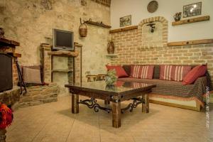 a living room with a couch and a table at Alexandros in Kato Loutraki