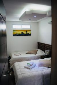 Posteľ alebo postele v izbe v ubytovaní Apartamento Amoblado En Guadalajara De Buga