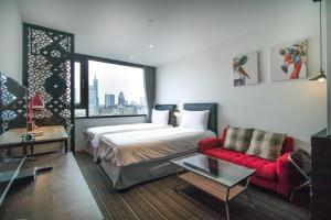A bed or beds in a room at NK Hostel