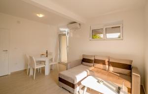 a living room with a couch and a table at SunnyApartments in Herceg-Novi +69 photos