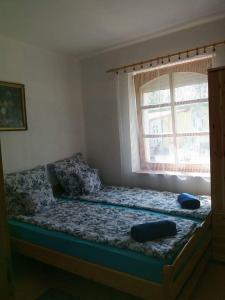 Giường trong phòng chung tại Turulpanzio&Gombeach