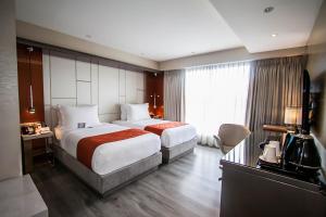 A bed or beds in a room at Hotel XYZ