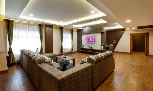 TV a/nebo společenská místnost v ubytování Hotel ARJUNAA