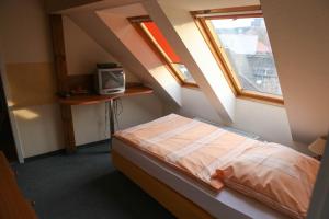 Postel nebo postele na pokoji v ubytování Barokk Antik Guest House